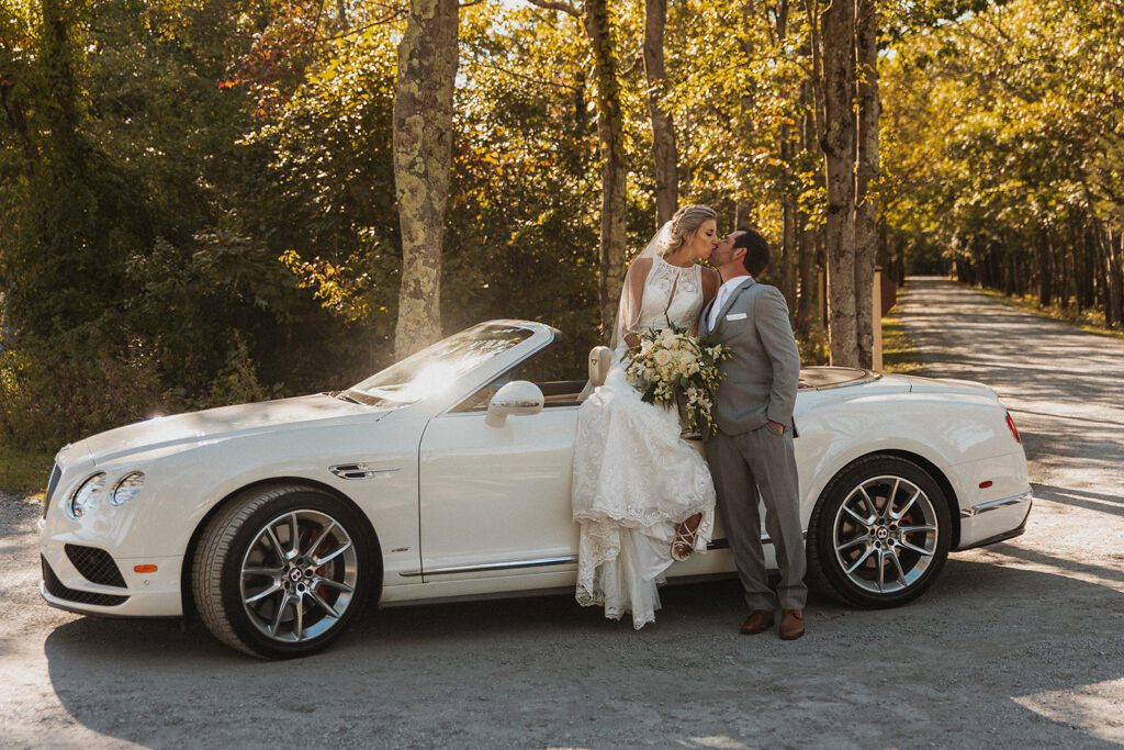 Elegant bride and groom photo with a vintage car