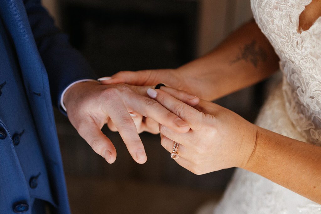 Bride and groom exchanging rings photo
