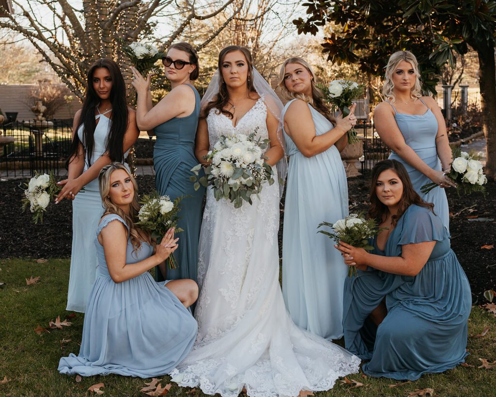 A fun bride and bridesmaids pose photo