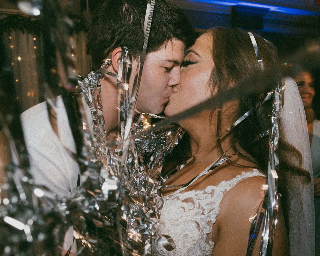 Bride and groom kiss during the wedding reception at Scotland Run Golf Club wedding venue