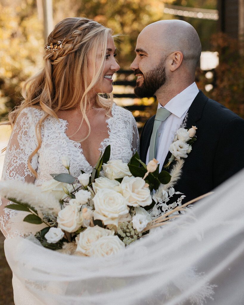 Romantic bride and groom veil photo