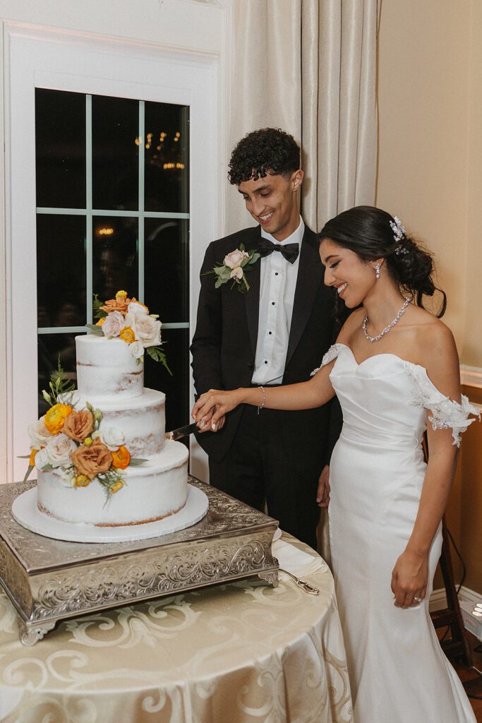beautiful bride and groom cake cutting photo