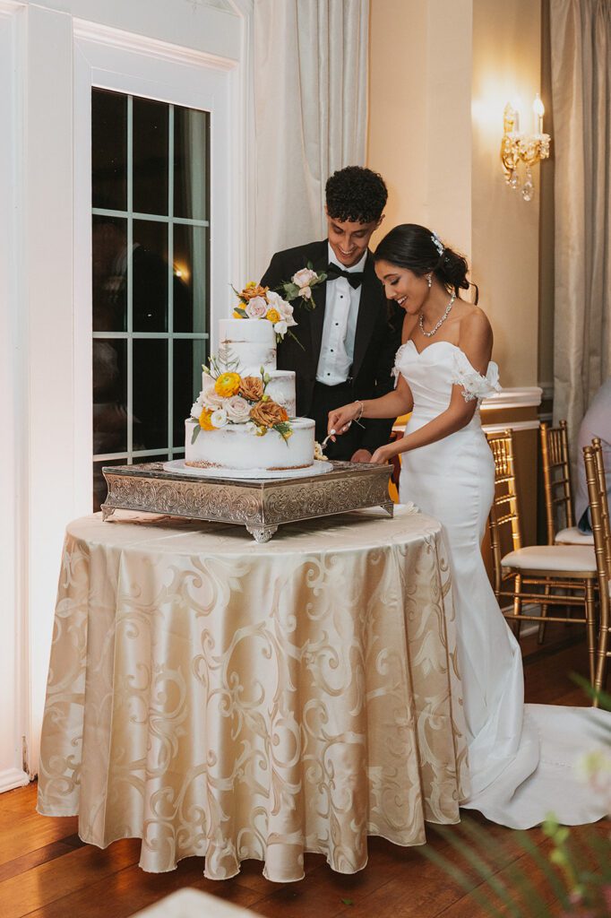beautiful bride and groom cake cutting photo