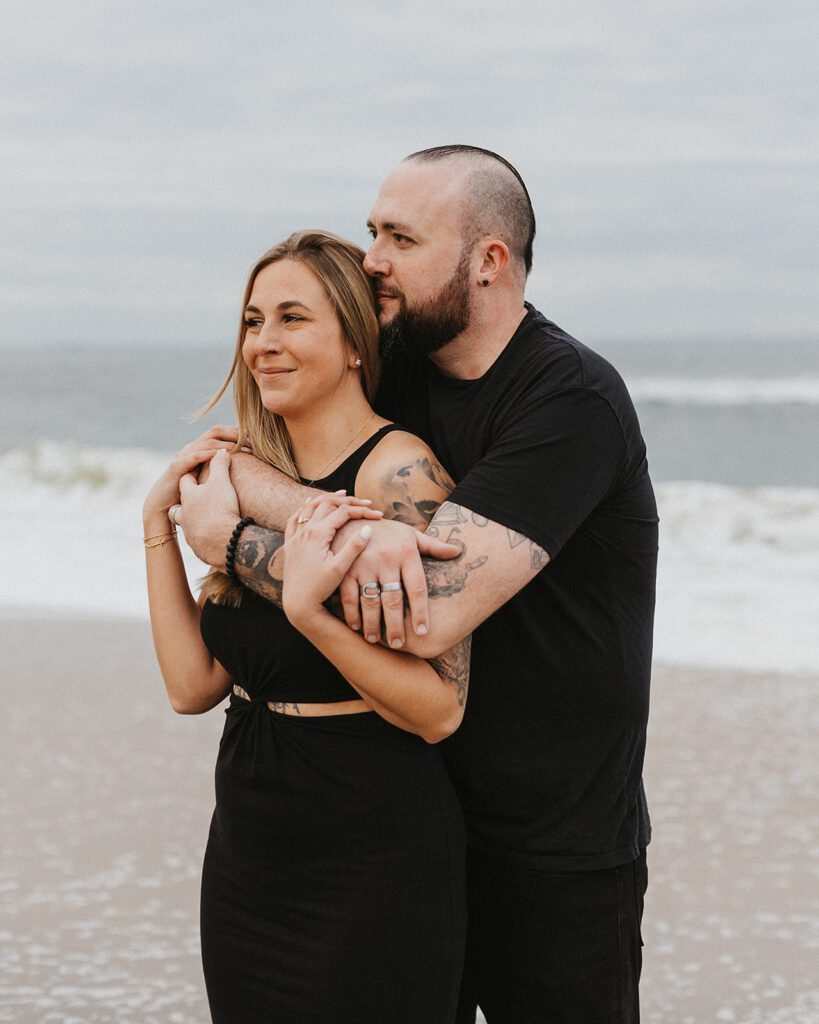 Sweet and playful engagement photos at the Sandy Hook beach