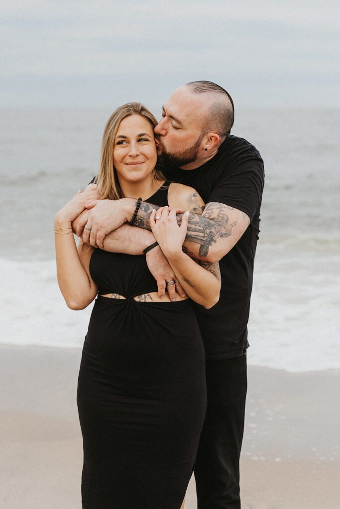 Sweet and playful engagement photos at the Sandy Hook beach