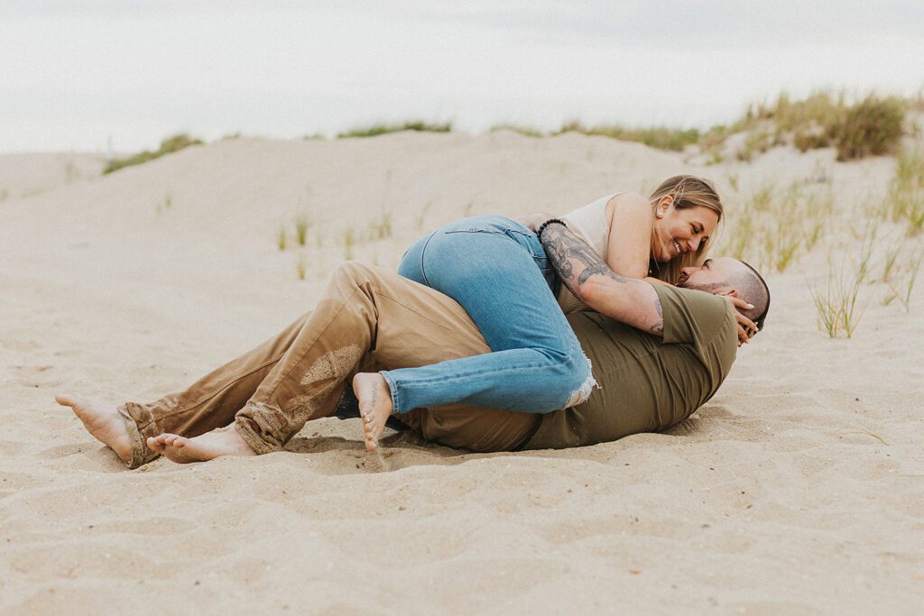 Sweet and playful photos from a Sandy Hook beach engagement shoot 
