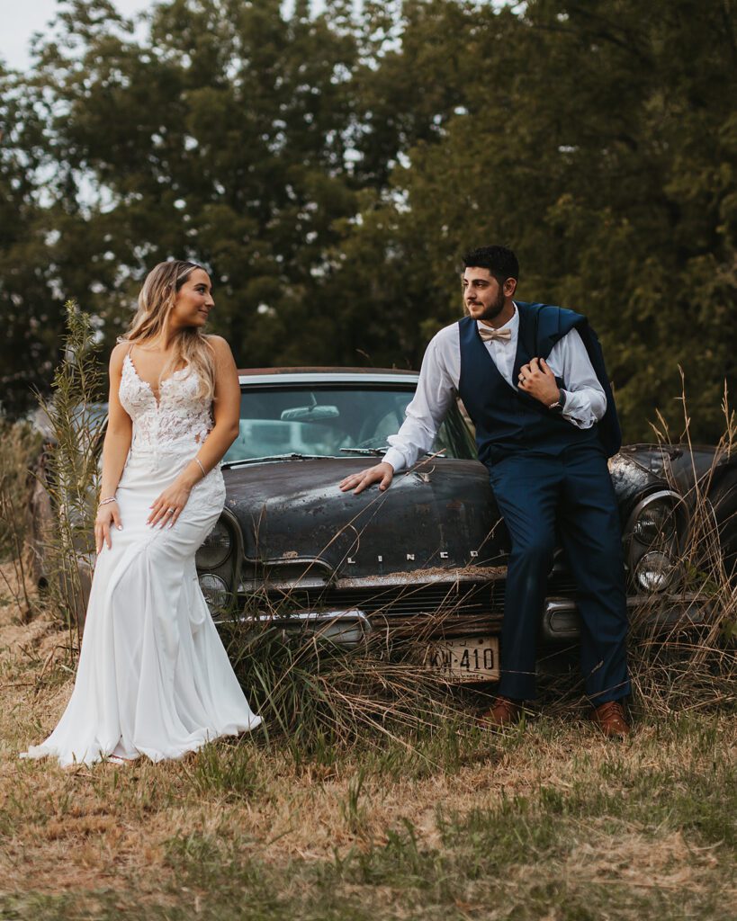 Bride and groom vintage car