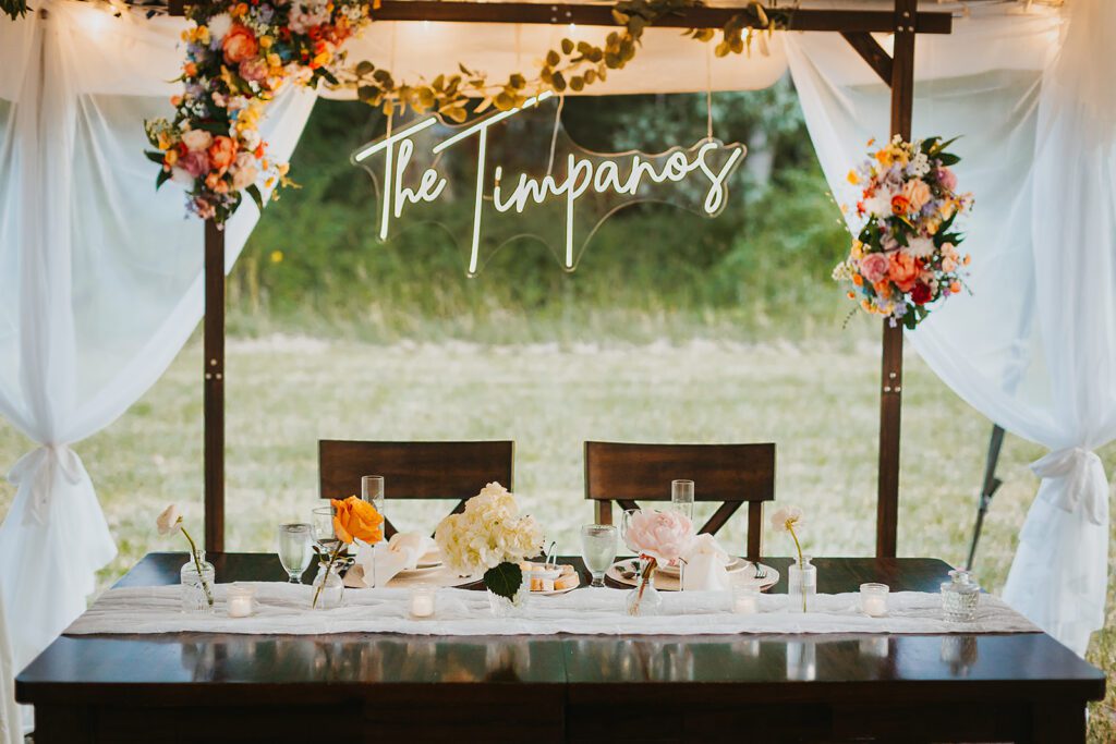 Bride and groom intimate backyard wedding table