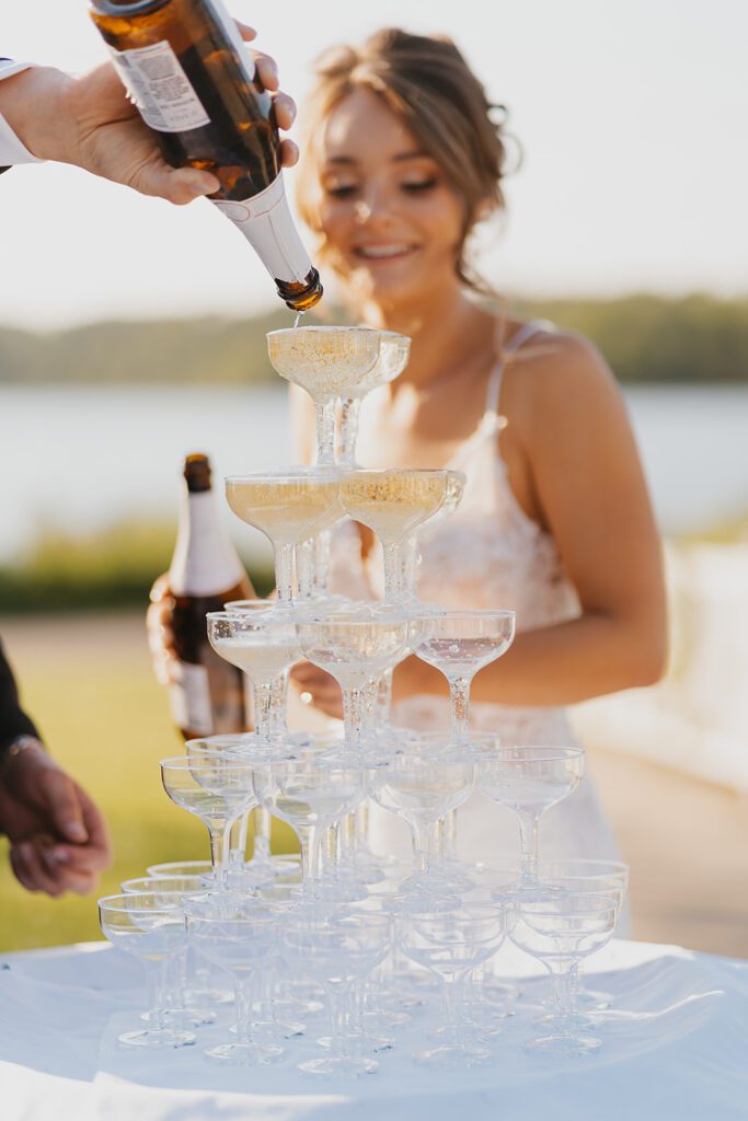 Bride and groom and champagne tower