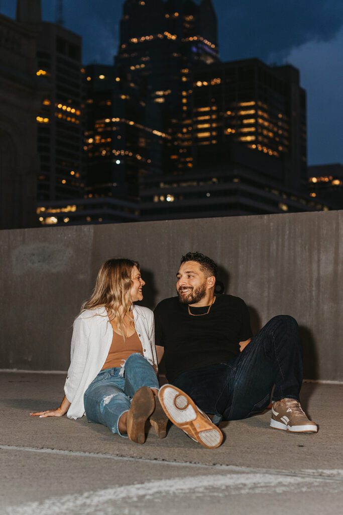 romantic nighttime city engagement photo on a rooftop in Philly