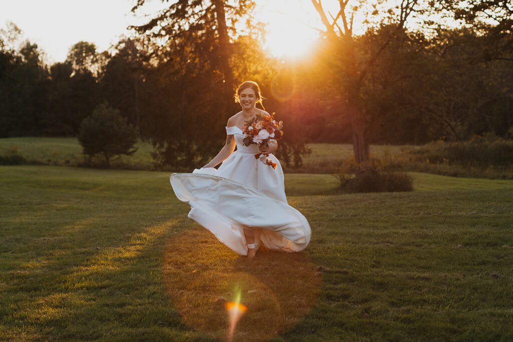 bridal golden hour photo in a field at an upstate new york wedding venue
