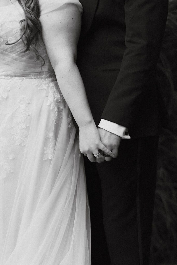 Bride and groom hands close up