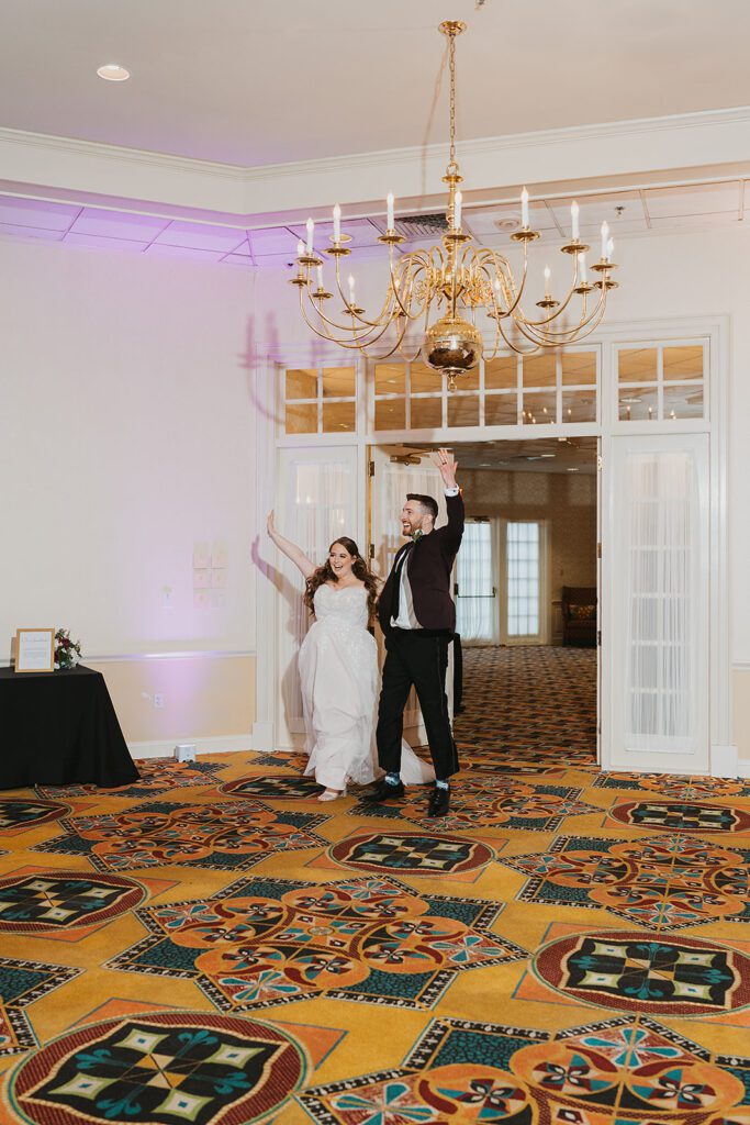 Fun bride and groom reception entrance