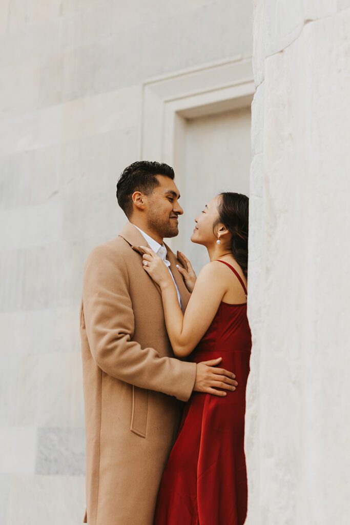 The couple enjoying a romantic moment outside the Merchants Exchange, surrounded by the beauty of Philadelphia's history
