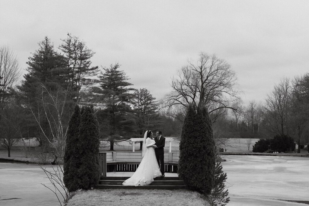 bride and groom outdoor wedding portraits during winter, bride is wearing a faux fur wrap