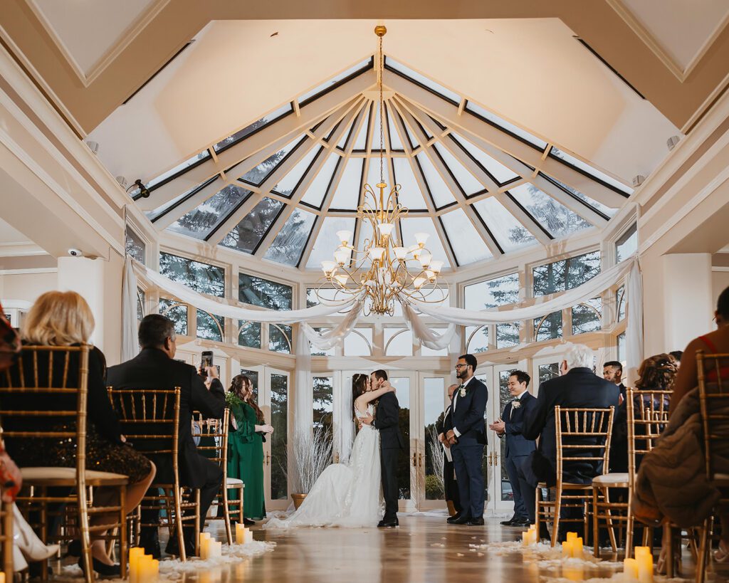 elegant wedding ceremony at the conservatory ballroom in birch hill estates