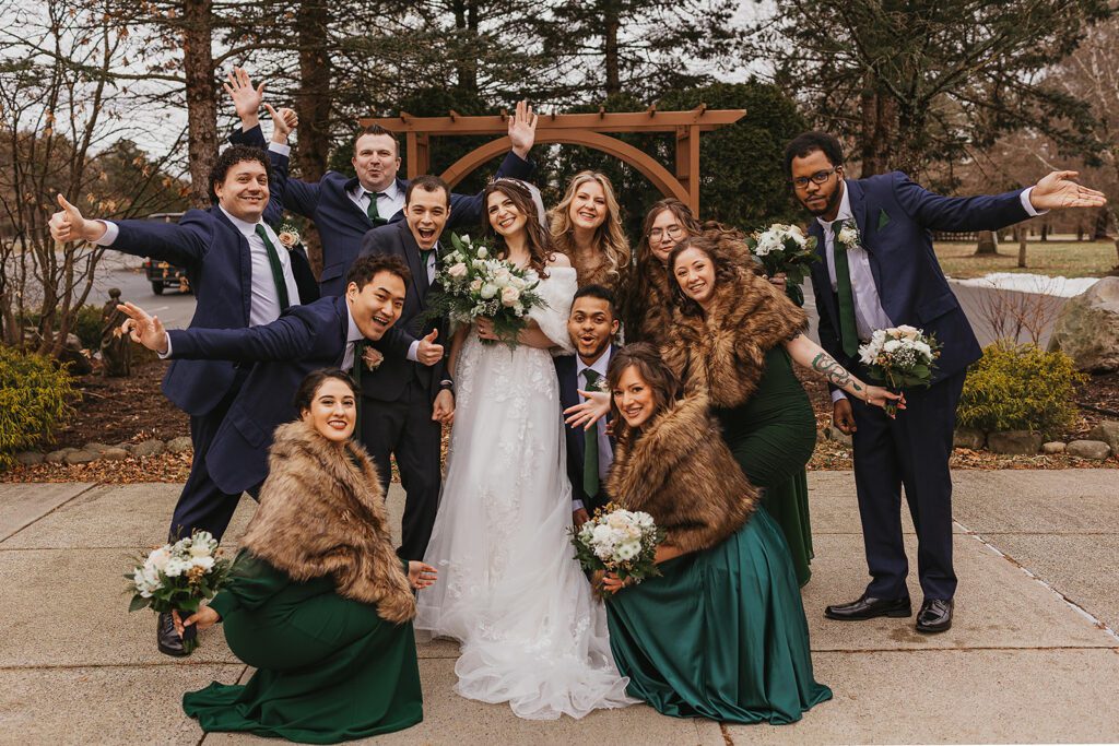 bride and groom and their winter wedding party