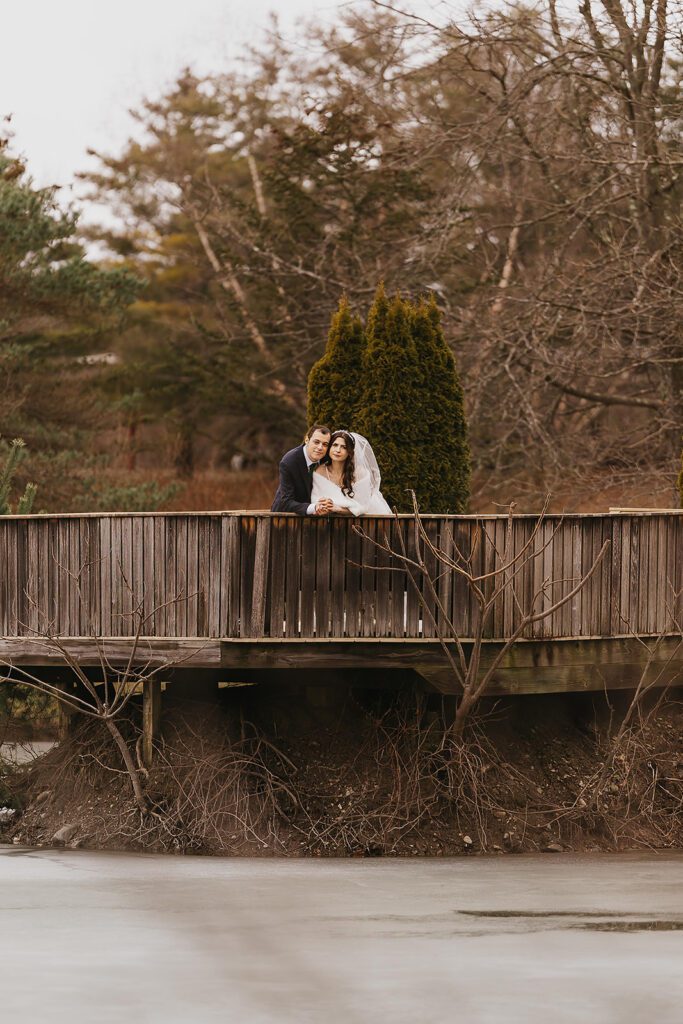 bride and groom outdoor wedding portraits during winter, bride is wearing a faux fur wrap