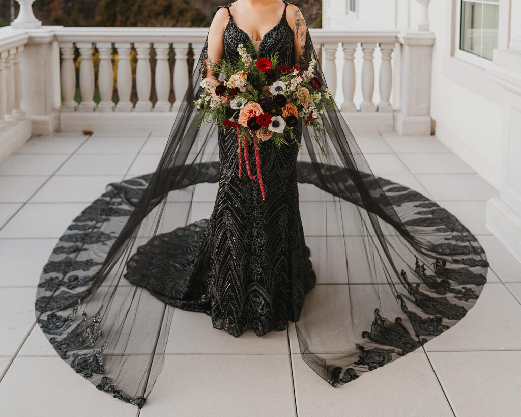 bridal portraits with an alternative, gothic bouquet and black wedding dress