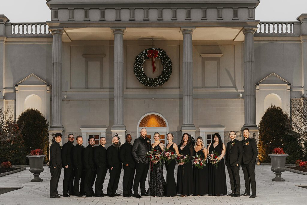 all black wedding party with bride and groom 