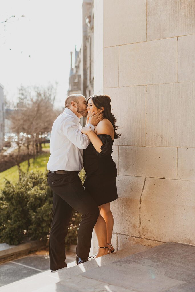 classy couple in downtown philadelphia during golden hour