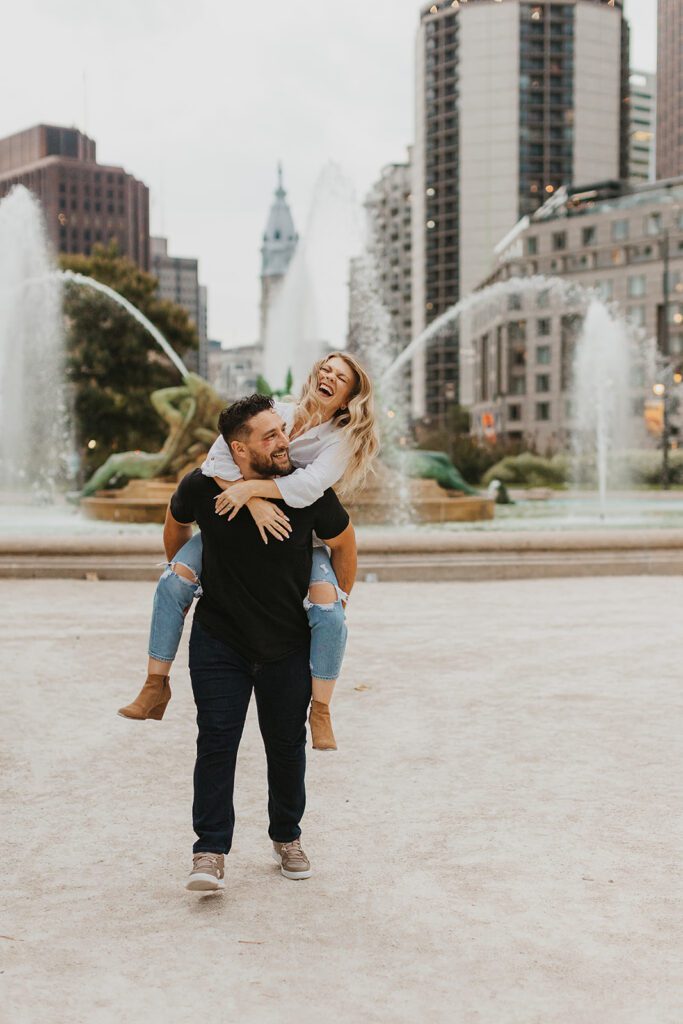 playful engaged couple in downtown philadelphia