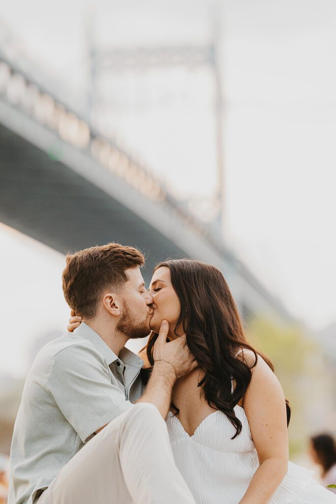 playful couple in a park in NYC