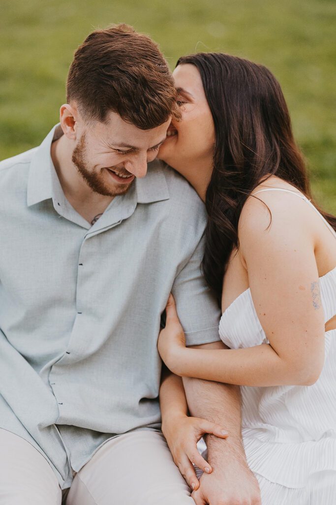 playful couple in a park in NYC