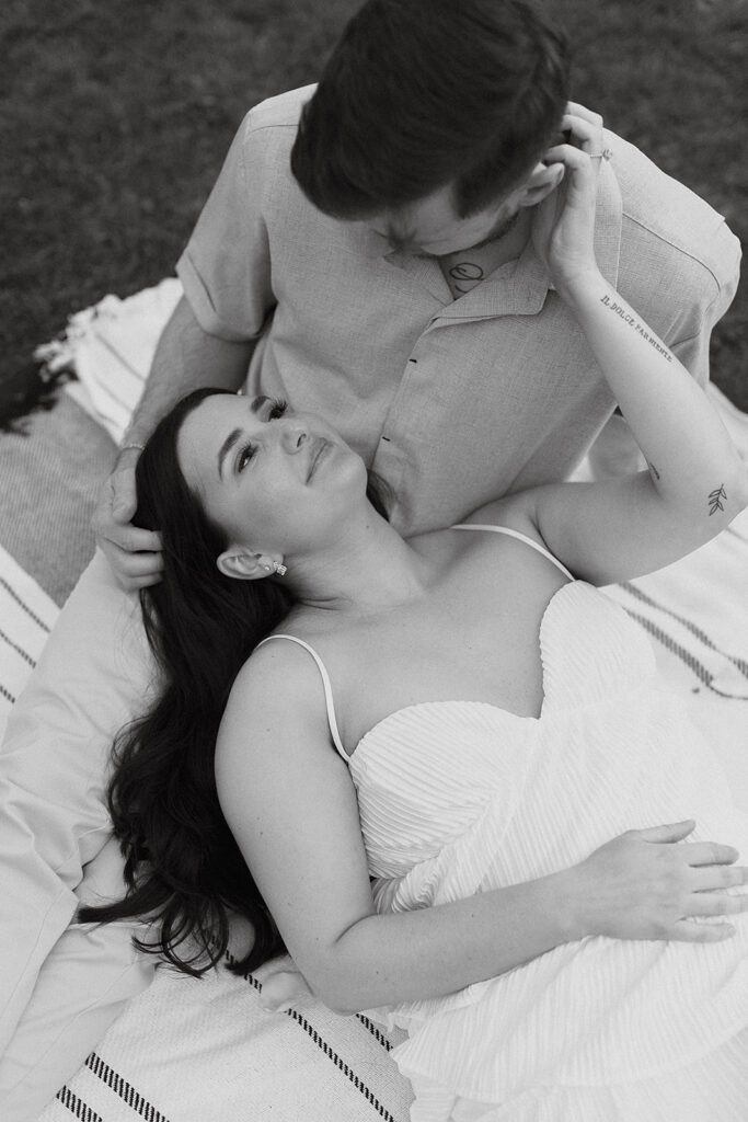 playful couple in a park in NYC