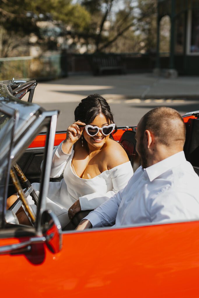 fun engagement photo in a vintage car