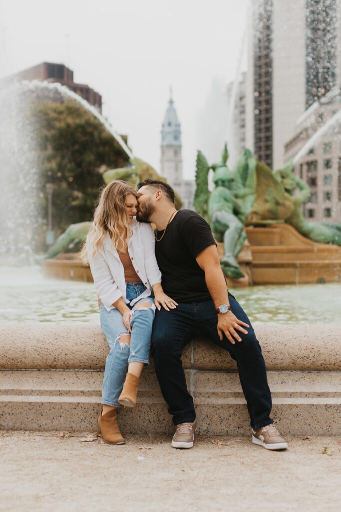 playful engaged couple in downtown philadelphia