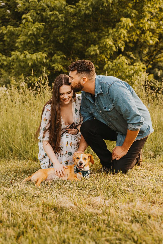 playful engaged couple in a field