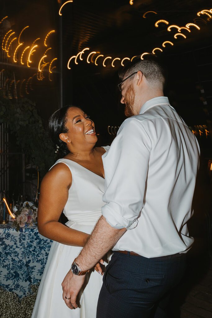 bride and groom dancing at their wedding reception