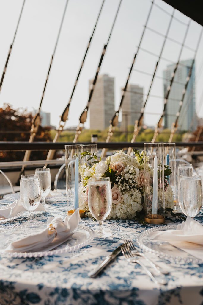 Blue and white floral arrangements, elegant place settings on Moshulu