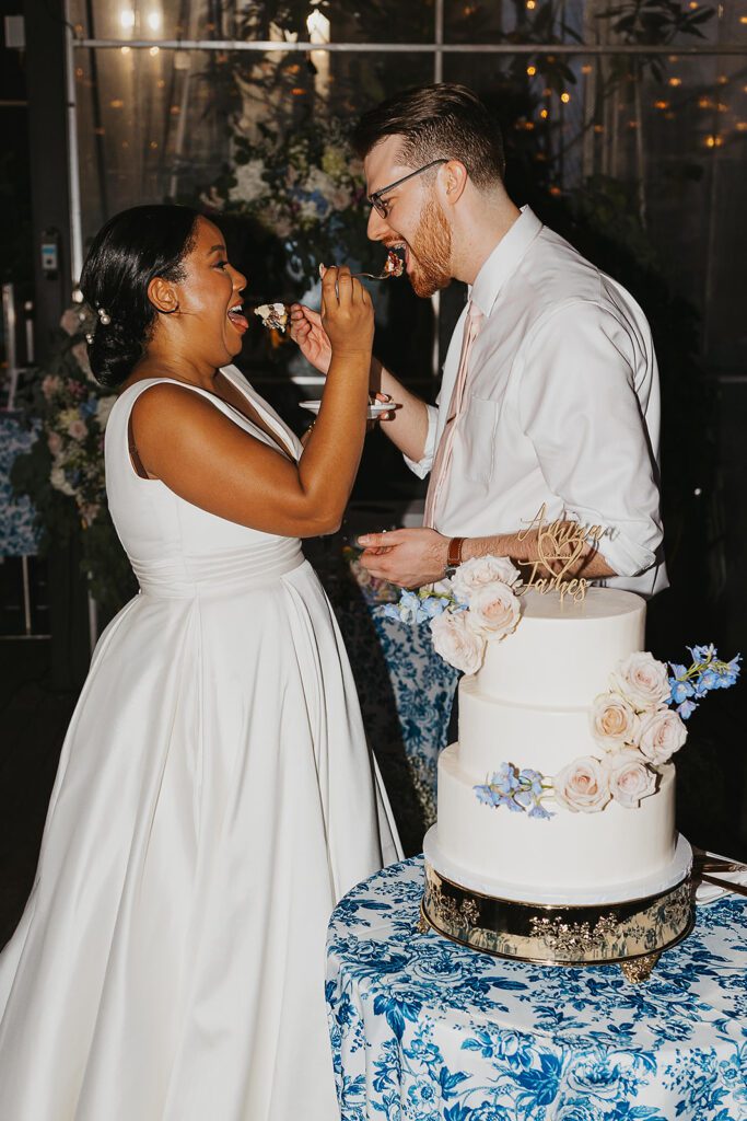 bride and groom cutting cake