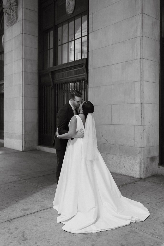 bride and groom first look in downtown Philadelphia surrounded by elegant architecture