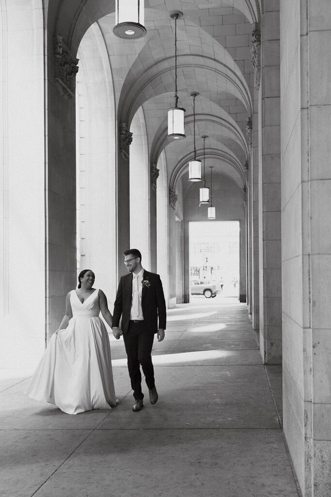 bride and groom first look in downtown Philadelphia surrounded by elegant architecture