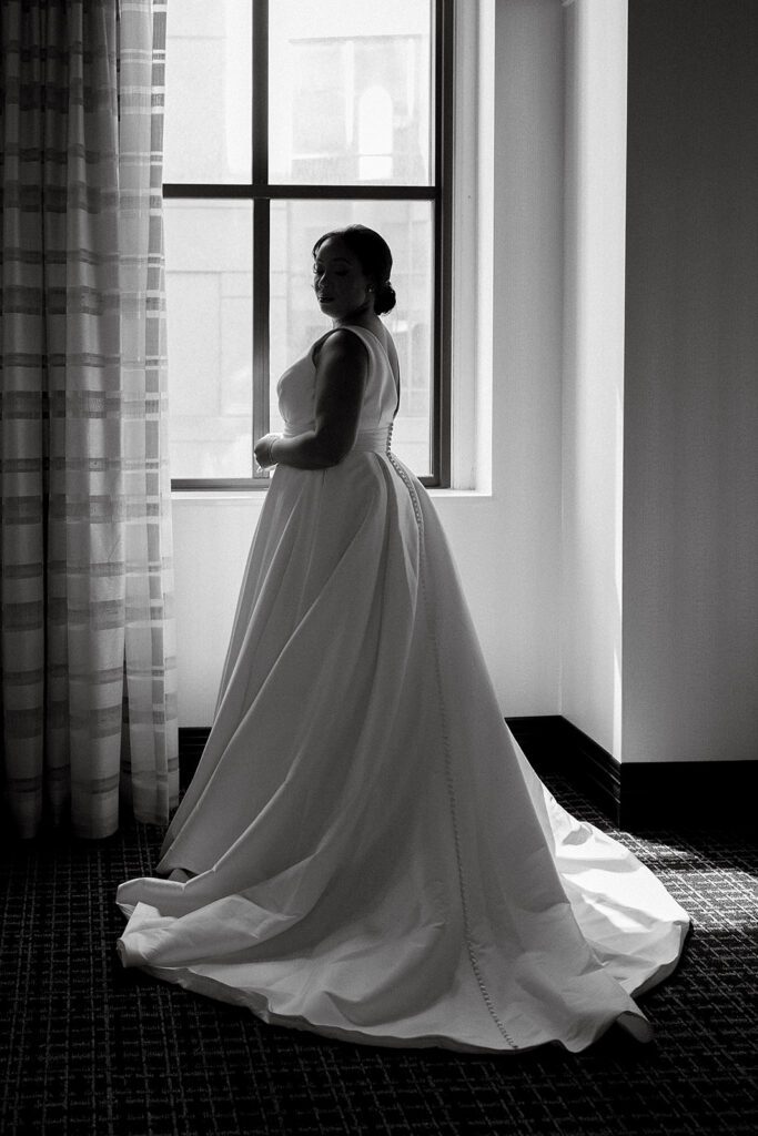 elegant bride getting ready portraits by the window