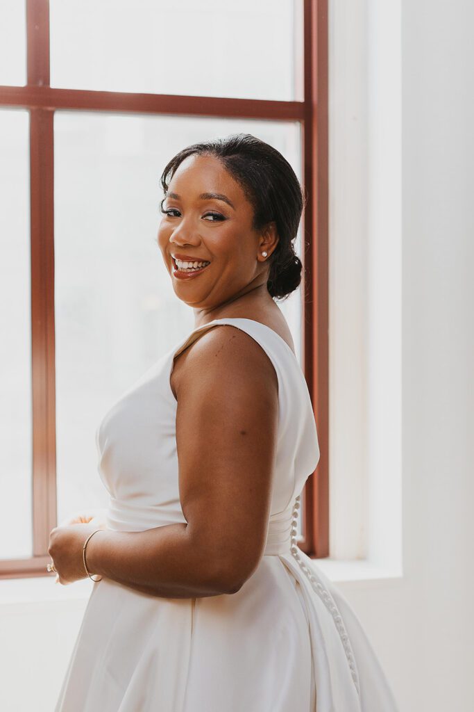 elegant bride getting ready portraits by the window