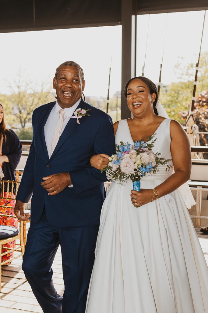 dad walking bride down the aisle on the boat wedding venue