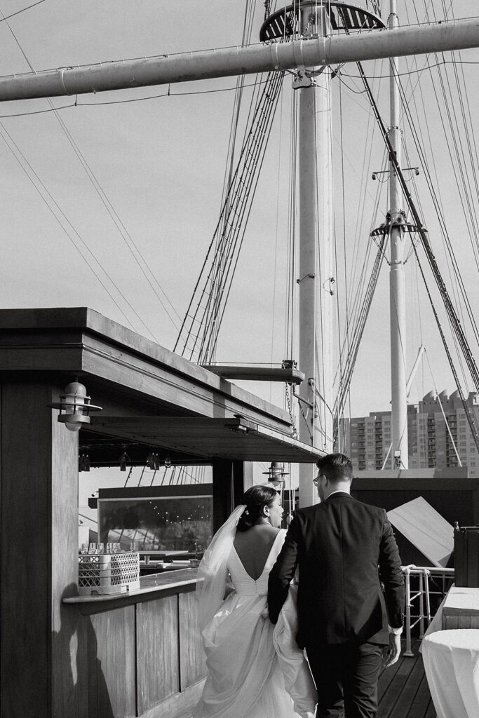 bride and groom roaming Moshulu deck for their boat wedding in Philadelphia