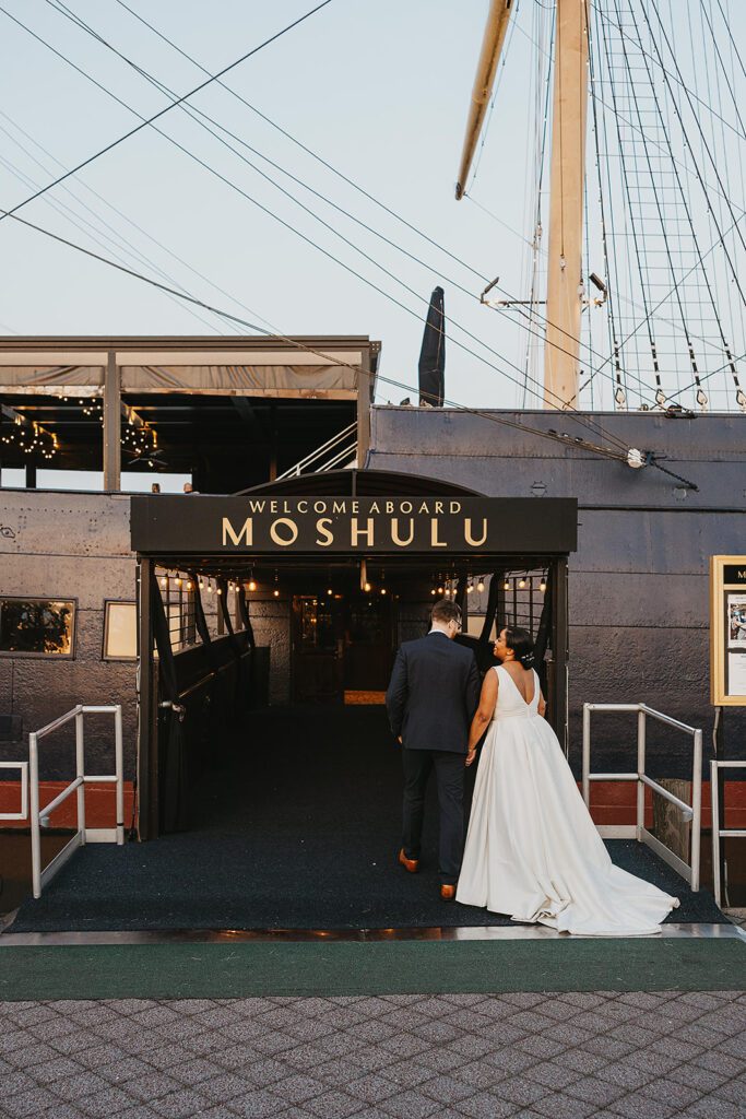 bride and groom roaming Moshulu deck for their boat wedding in Philadelphia