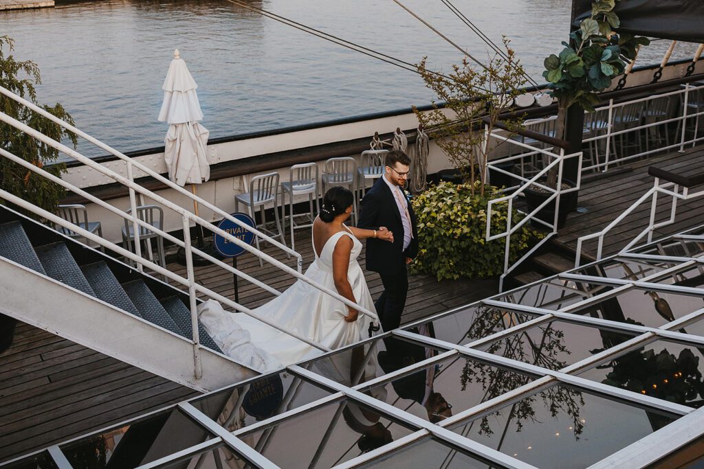 bride and groom roaming Moshulu deck for their boat wedding in Philadelphia