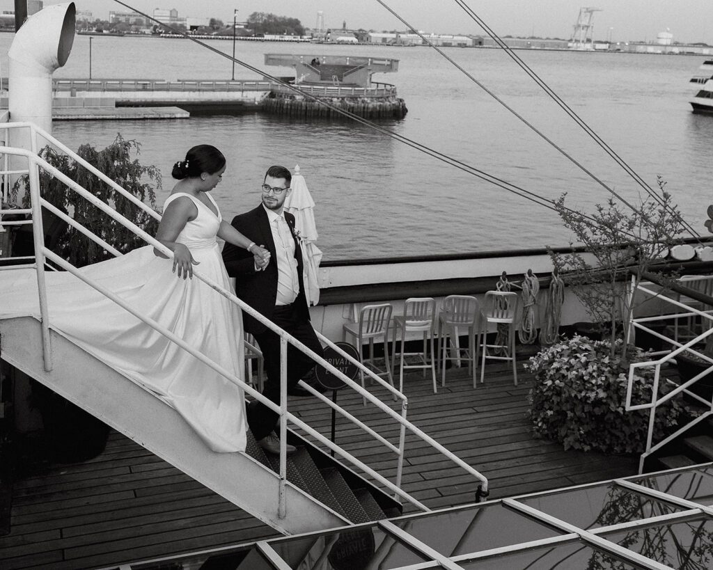 bride and groom roaming Moshulu deck for their boat wedding in Philadelphia