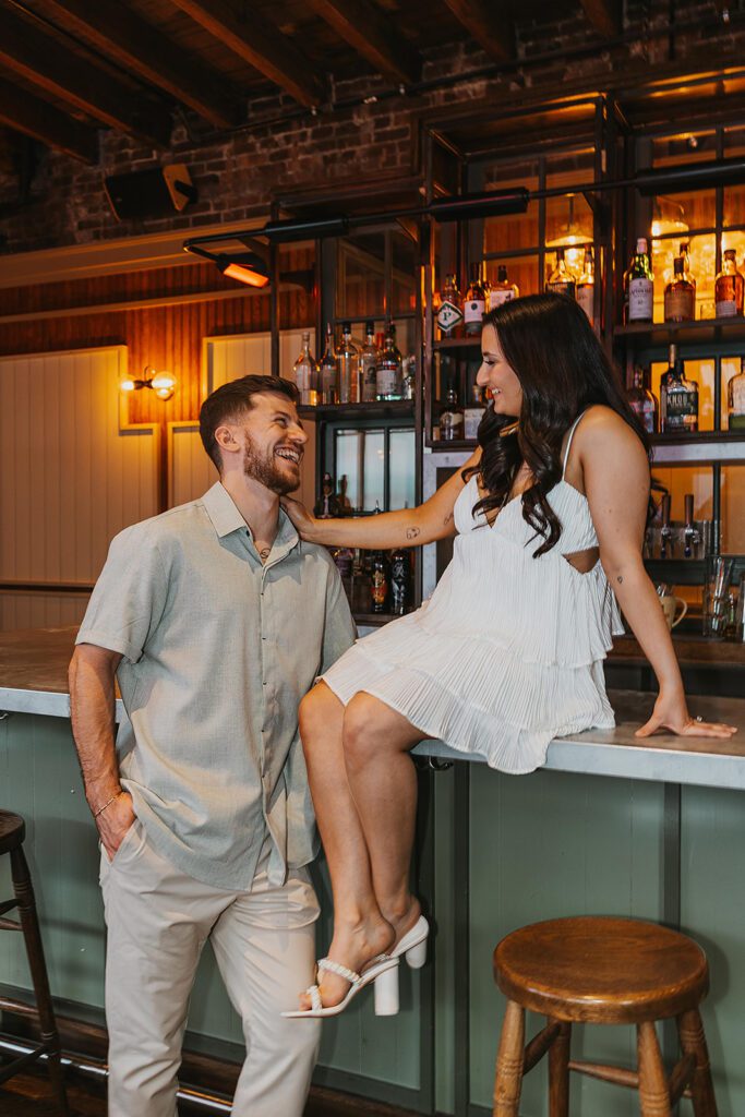 playful couple in Sweet Afton bar