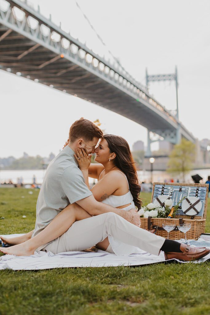 playful engagement photos in Astoria Park