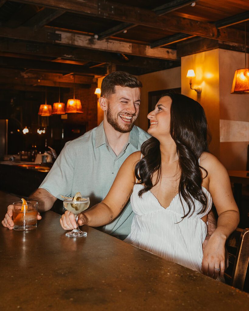 playful couple in Sweet Afton bar