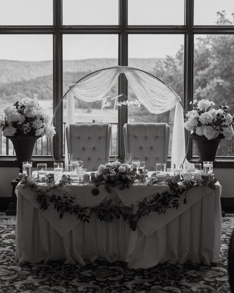 black and white photo of an elegant wedding sweethearts table