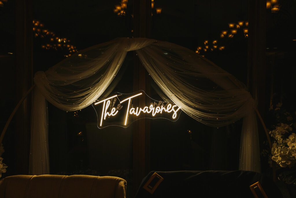 neon sign of the couple's last name at the Stroudsmoor Country Inn wedding reception