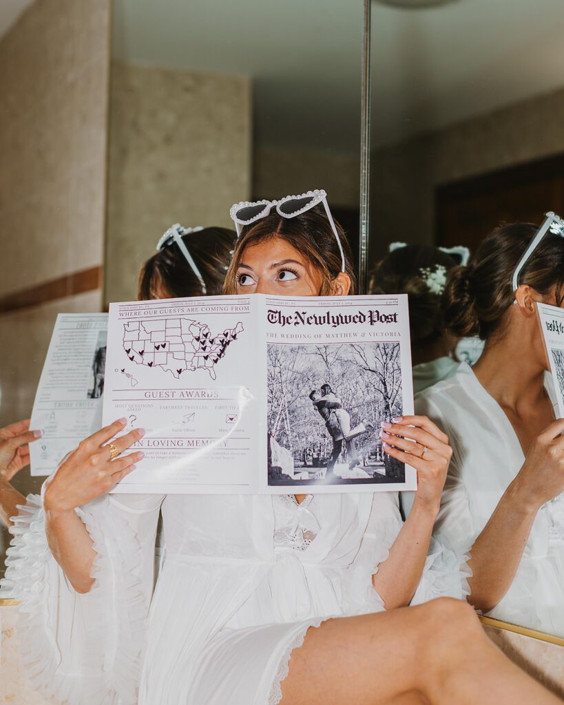 bride posing with their newly wed magazine